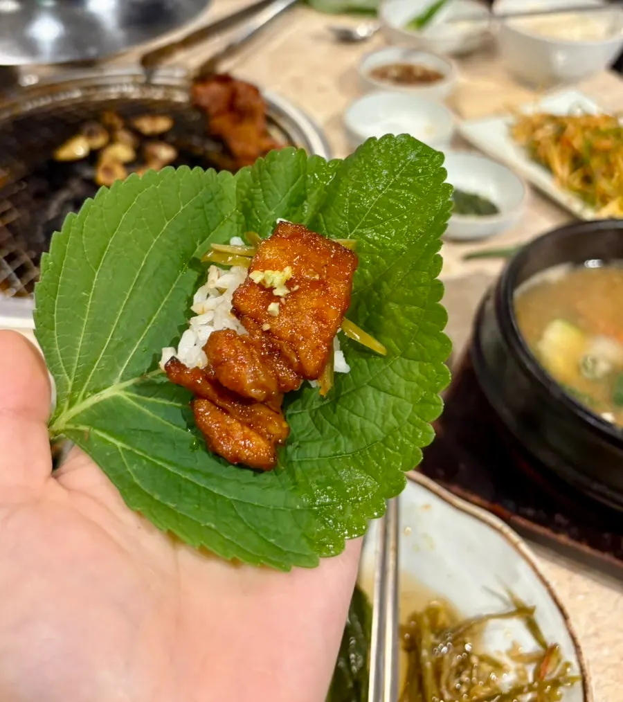 Gochujang samgyeopsal wrapped in perilla leaf with pickled chili