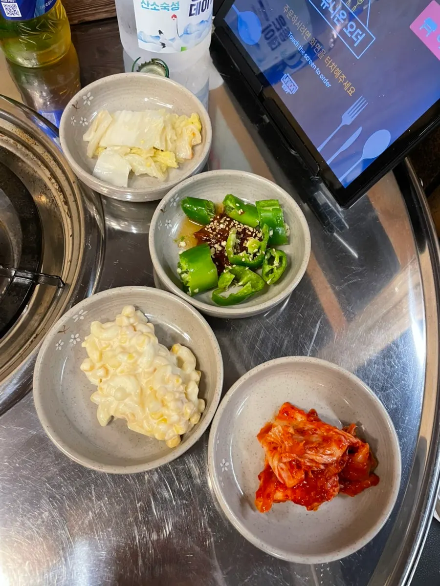 Full spread of side dishes at Taepung Gopchang