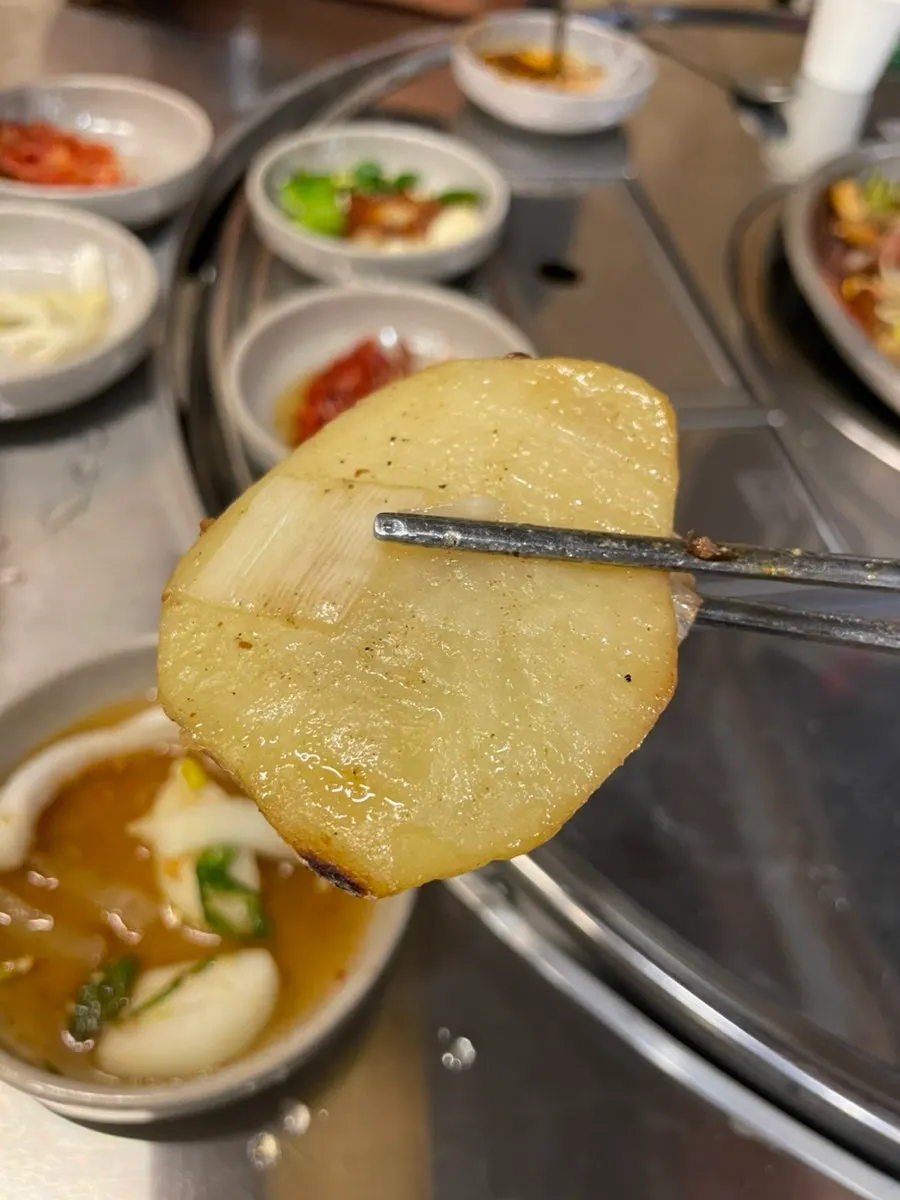 A piece of gopchang eaten with fernbrake
