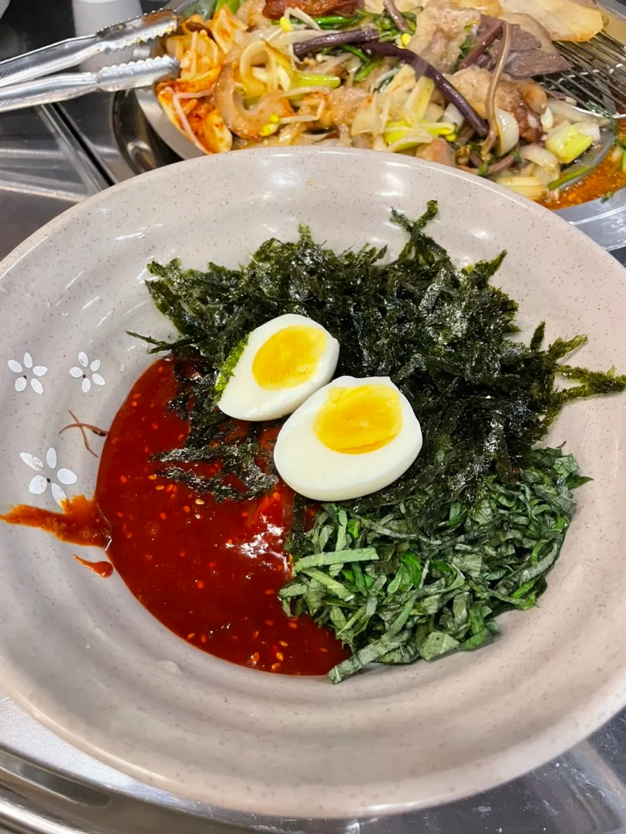 Boiled egg on top of the bibim naengmyeon