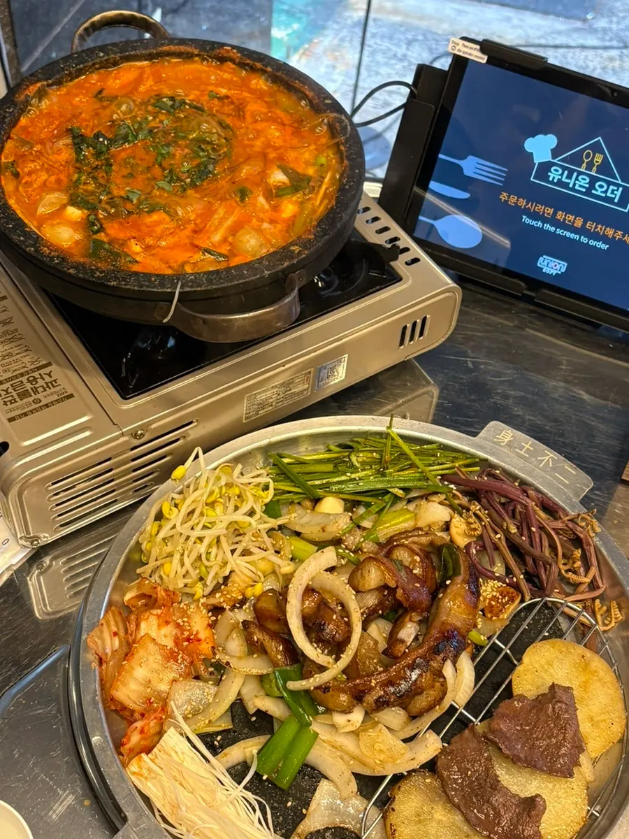 Spicy gopchang hot pot broth simmering