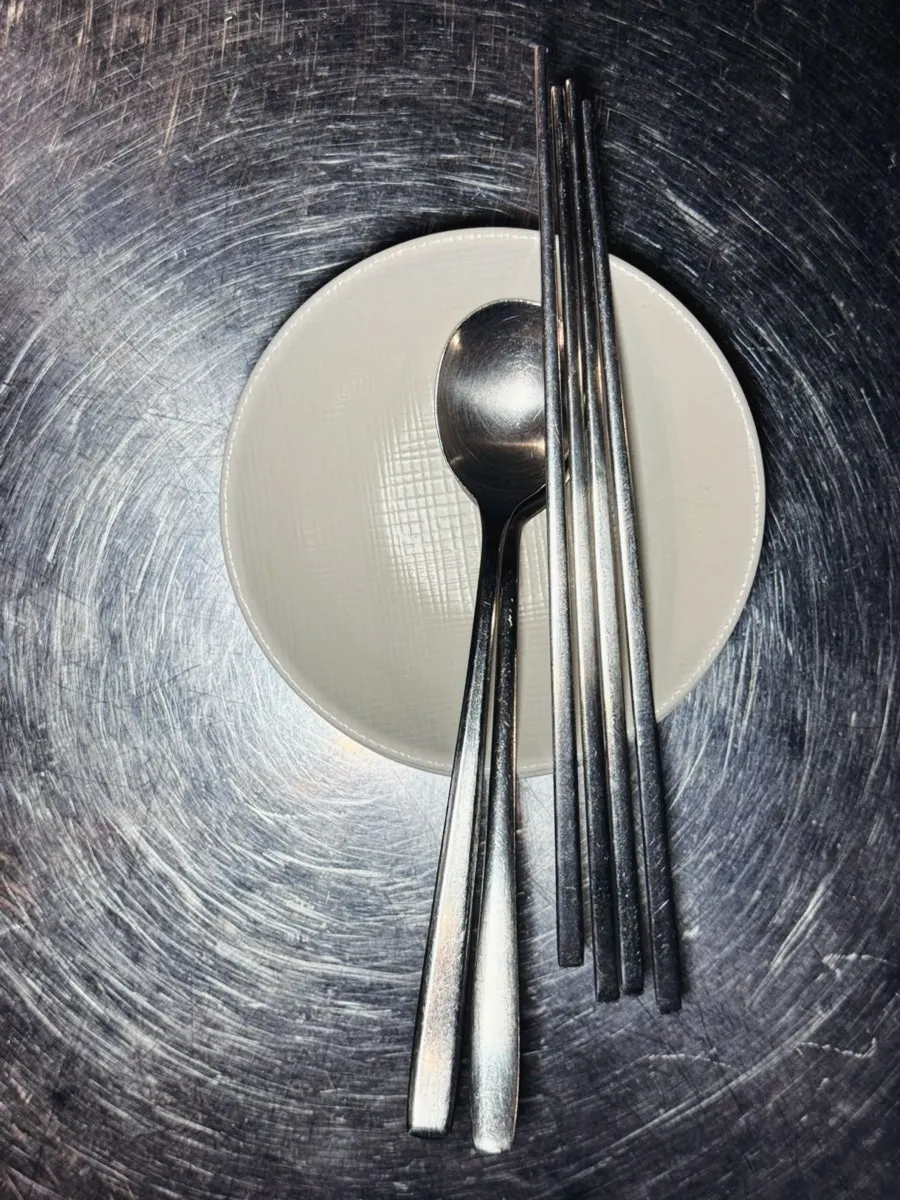 Basic table setting with small plates and utensils