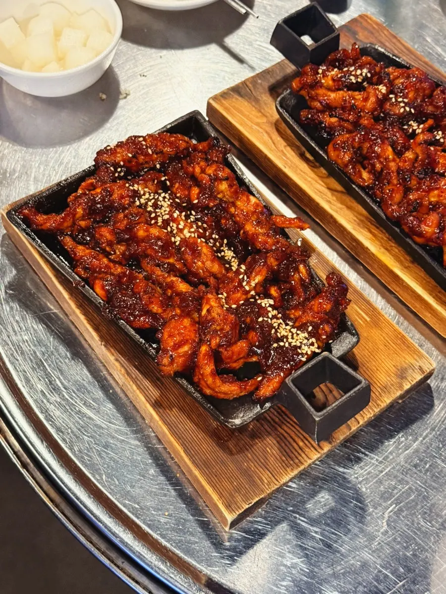 Boneless dakbal served with a soft sauce on the side