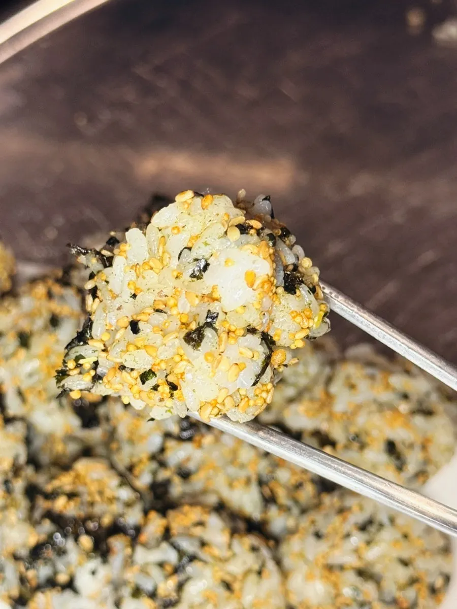 A rice ball topped with boneless dakbal sauce