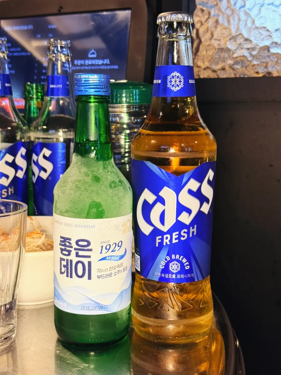 Soju and beer enjoyed alongside dakbal