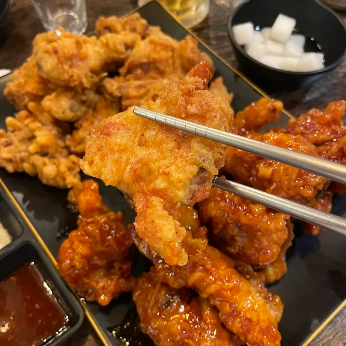 Half-and-half chicken and draft beer table spread