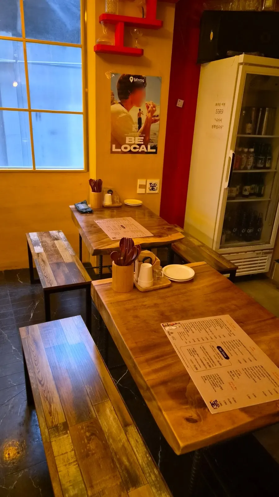 Table seating and seats near the grill at Teppan King