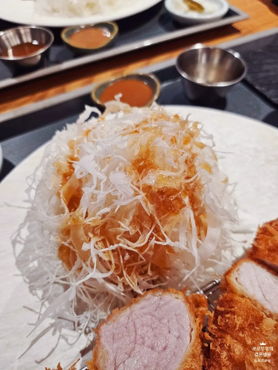 Picking up a piece of tonkatsu with chopsticks