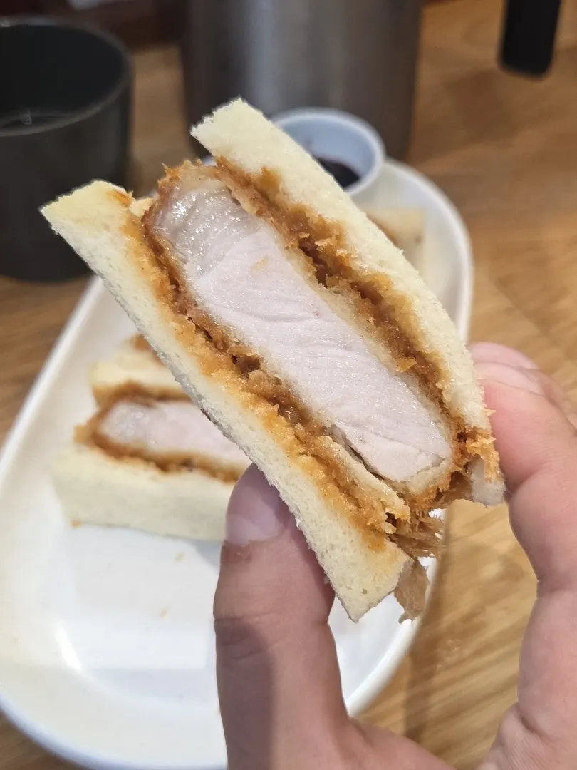 Cross-section of the katsu sando with a thick cutlet inside