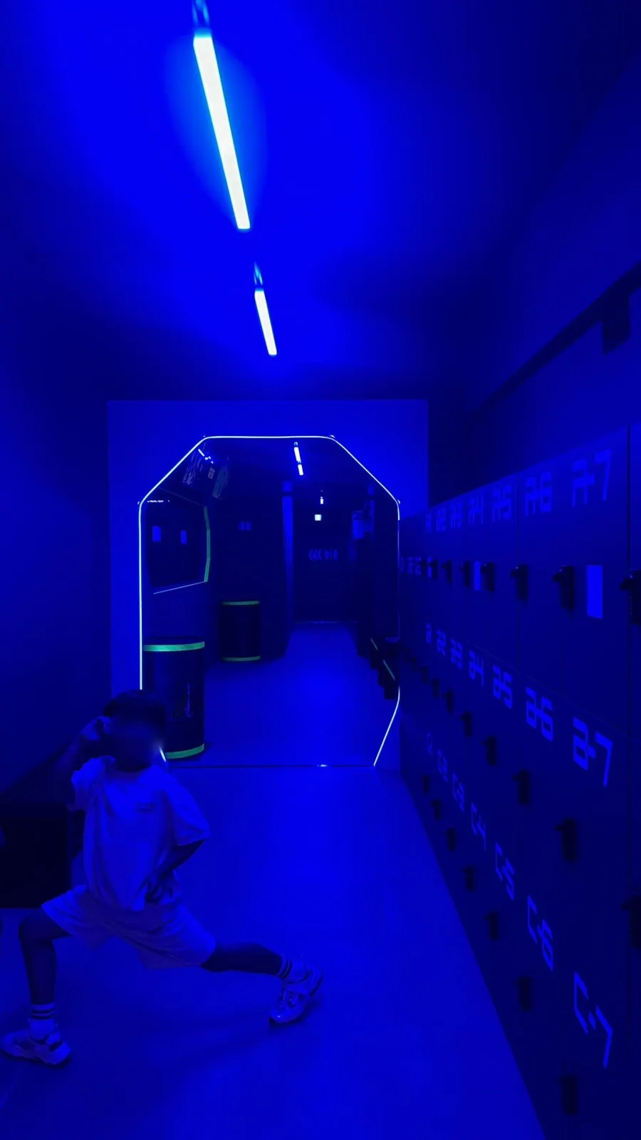 A kid aiming a laser gun