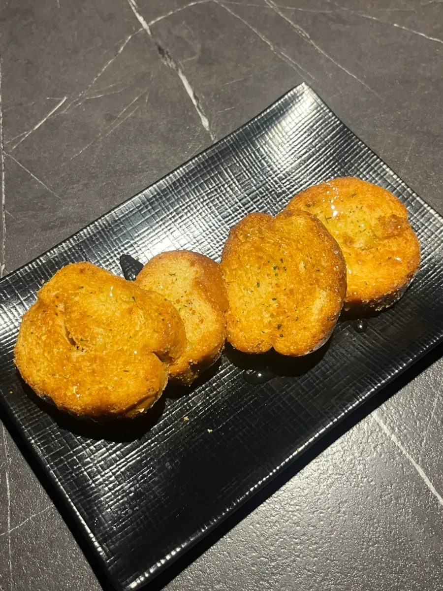Garlic baguette served as the basic side dish