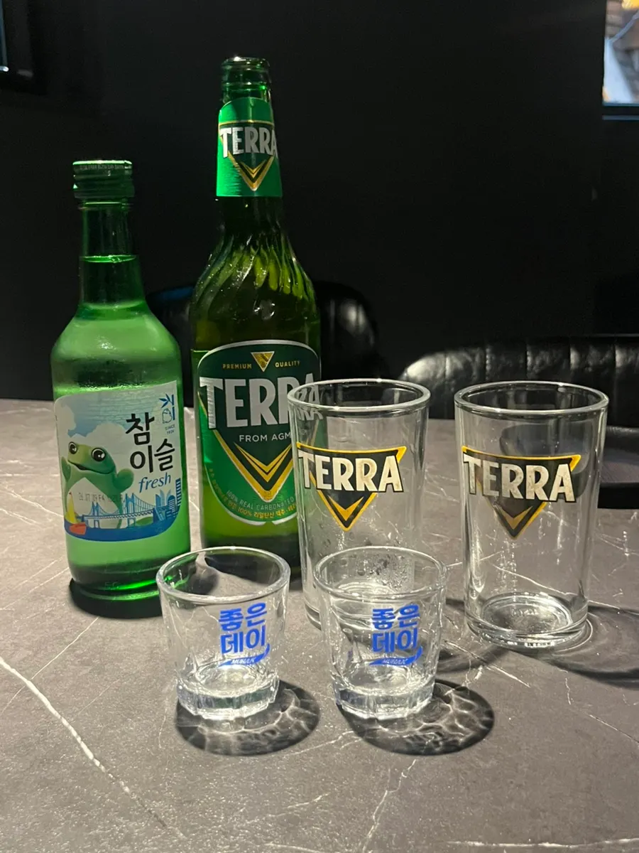 Soju and beer glasses for somaek on the table