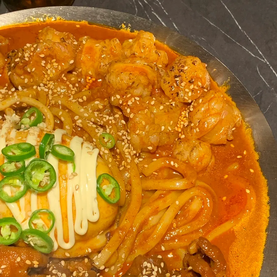 Beef intestine, chicken feet, and cuttlefish arranged together in the O-Dae-Bal platter