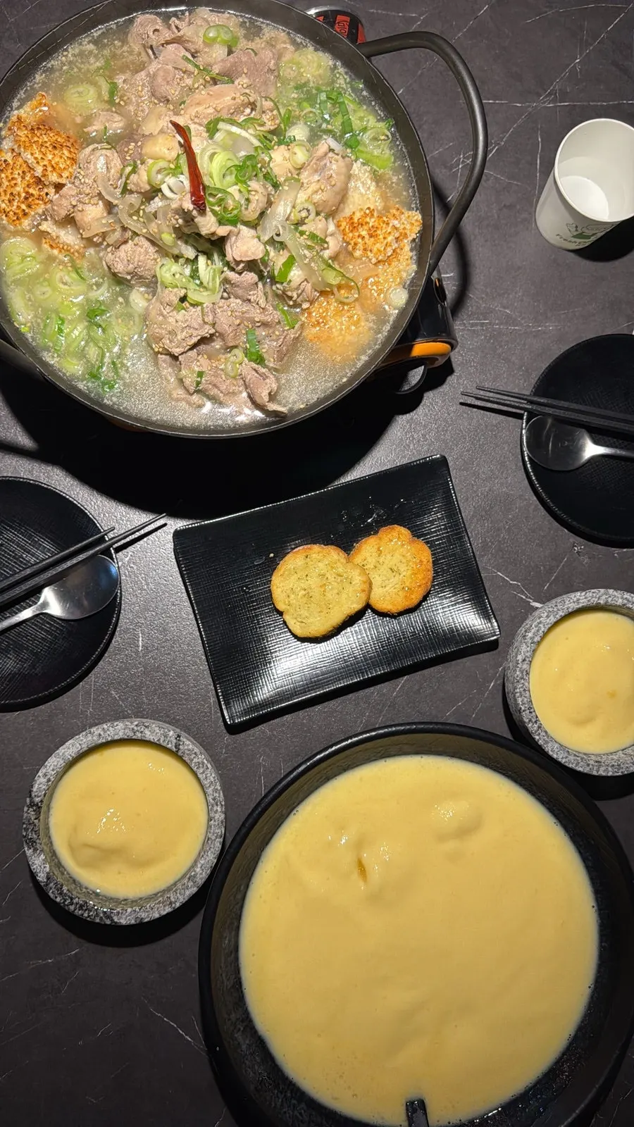 Chicken soup and honey mango makgeolli set on the table