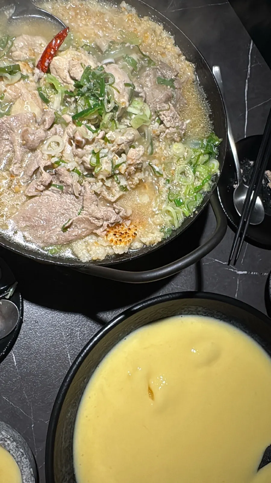 Full table view of the chicken soup and makgeolli