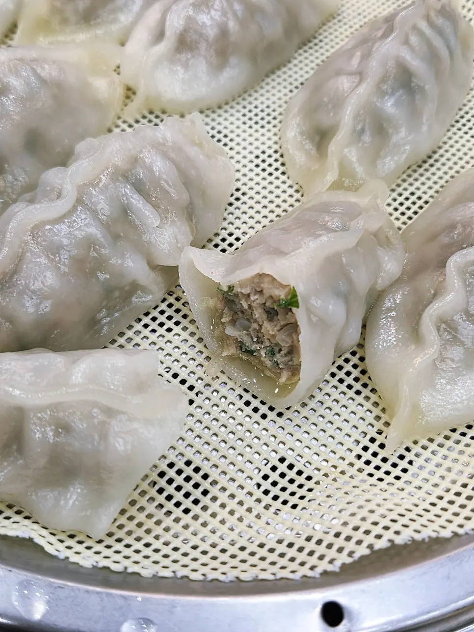 Cross-section of a halved handmade dumpling at Seomyeon Milmyeon