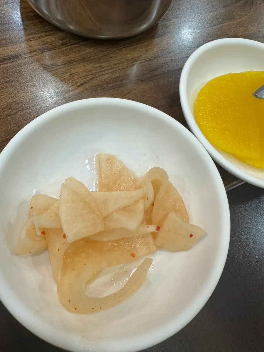 Mul-milmyeon topped with garnish at Seomyeon Milmyeon