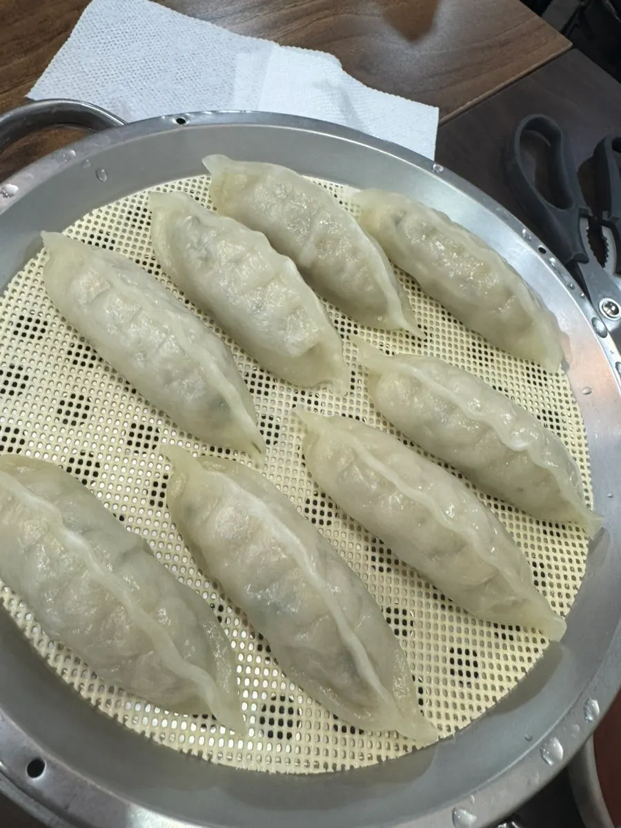 Final table spread of mul-milmyeon and dumplings at Seomyeon Milmyeon