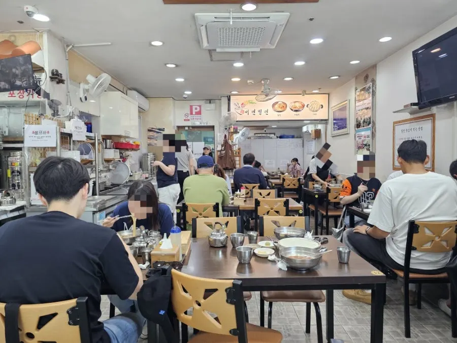 Interior of Seomyeon Milmyeon with customers seated