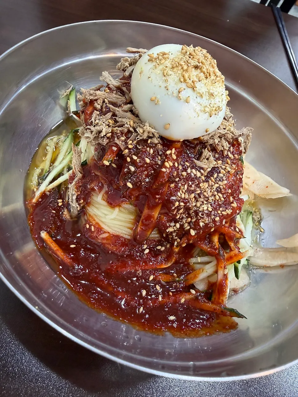 Milmyeon topped with hand-torn garnish