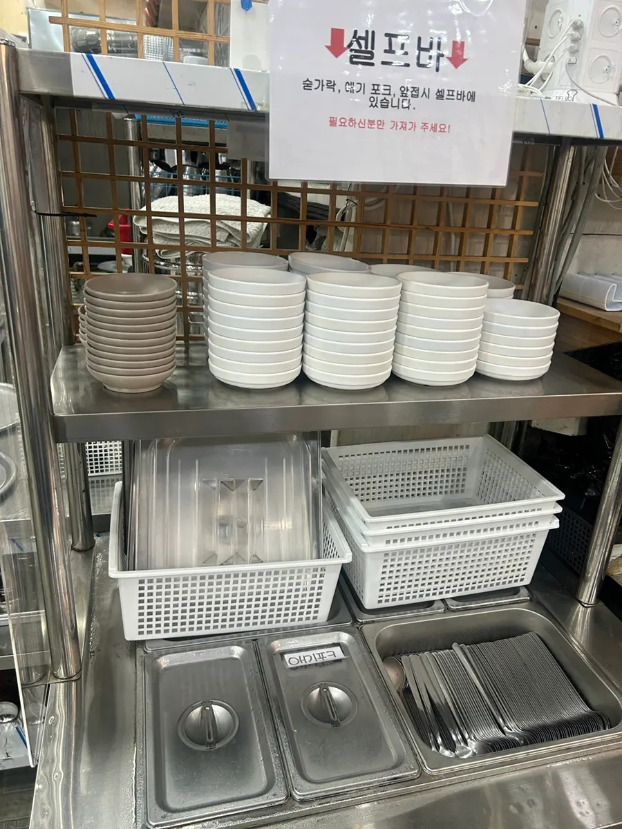 Cutlery station with baby spoon, fork, and small plate