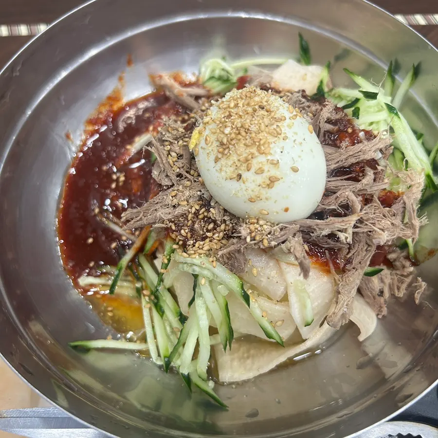 A bowl of bibim milmyeon in sweet-and-tangy sauce