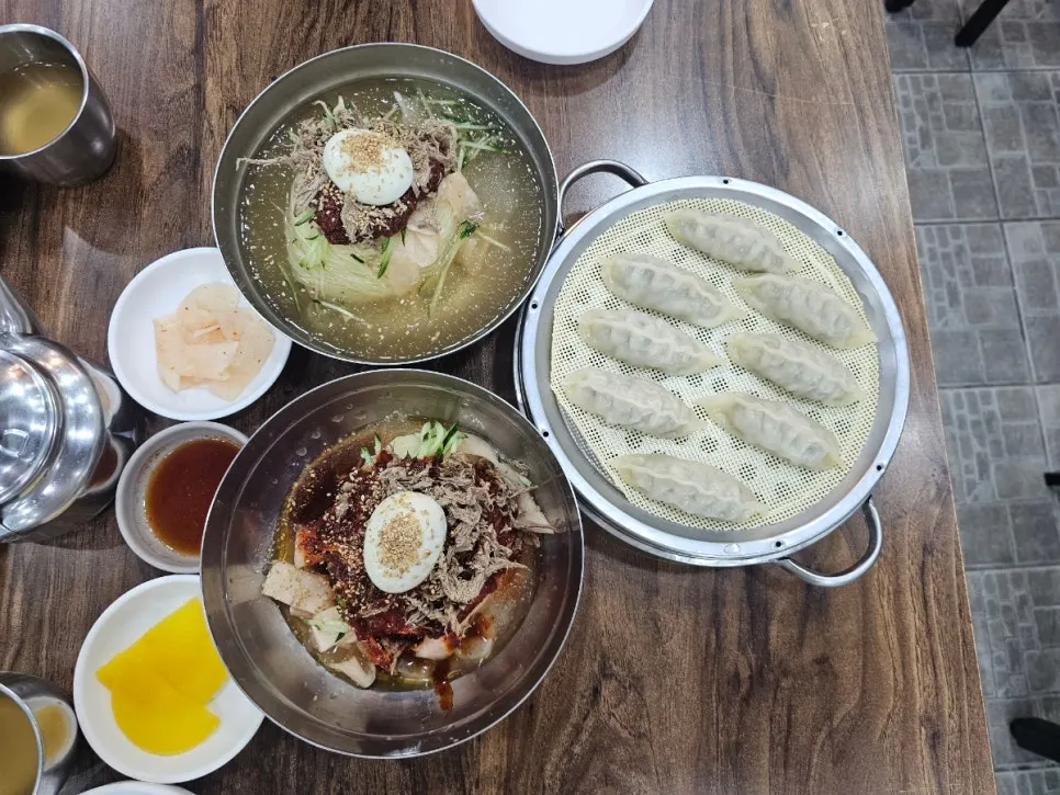 Table spread of mul-milmyeon, bibim-milmyeon and dumplings
