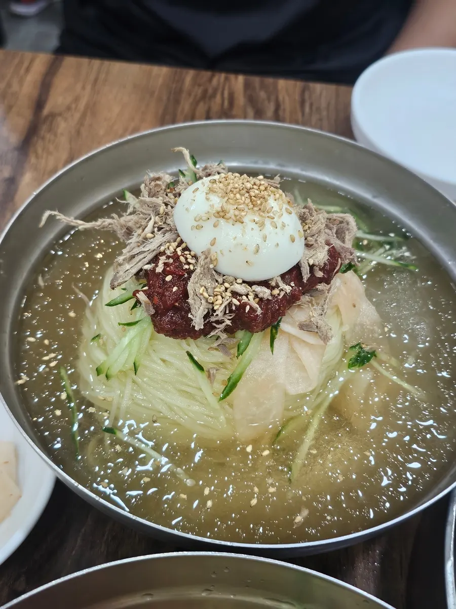 Mul-milmyeon with egg and sliced beef over icy broth