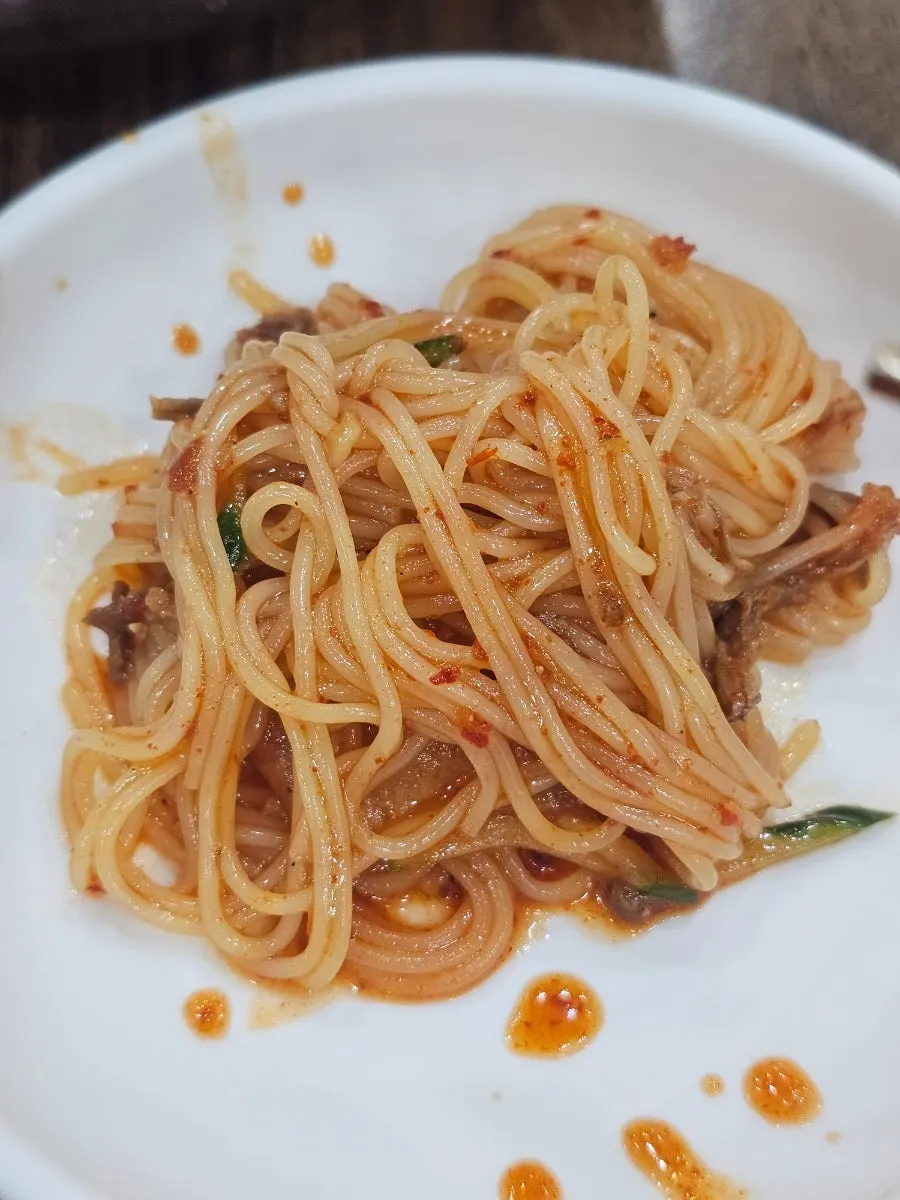 Bibim-milmyeon lifted with chopsticks