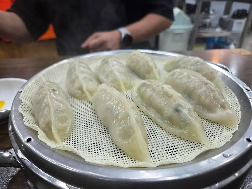 A dumpling split in half showing the filling
