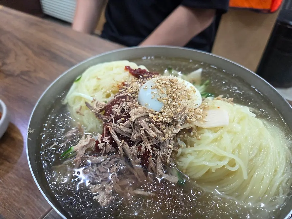 Mul-milmyeon broth with icy slush floating on top