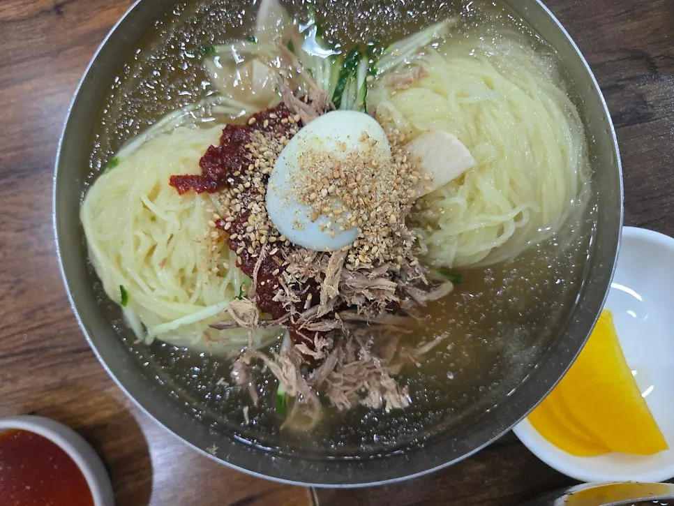 Cucumber, meat, and egg toppings on mul-milmyeon