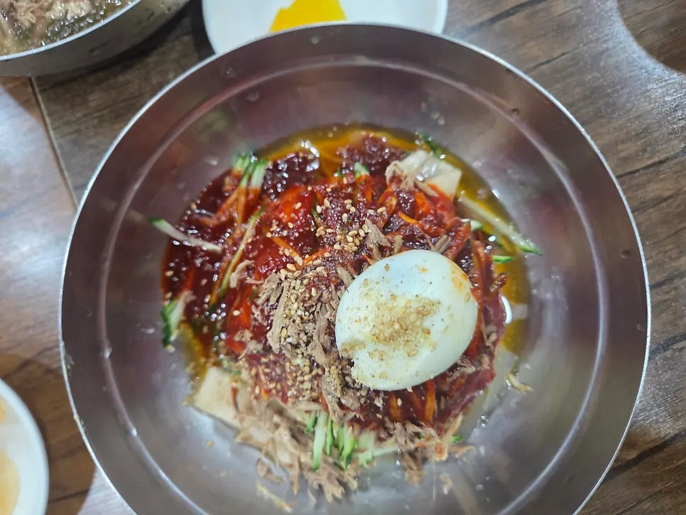 Table with bibim-milmyeon, mul-milmyeon, and dumplings