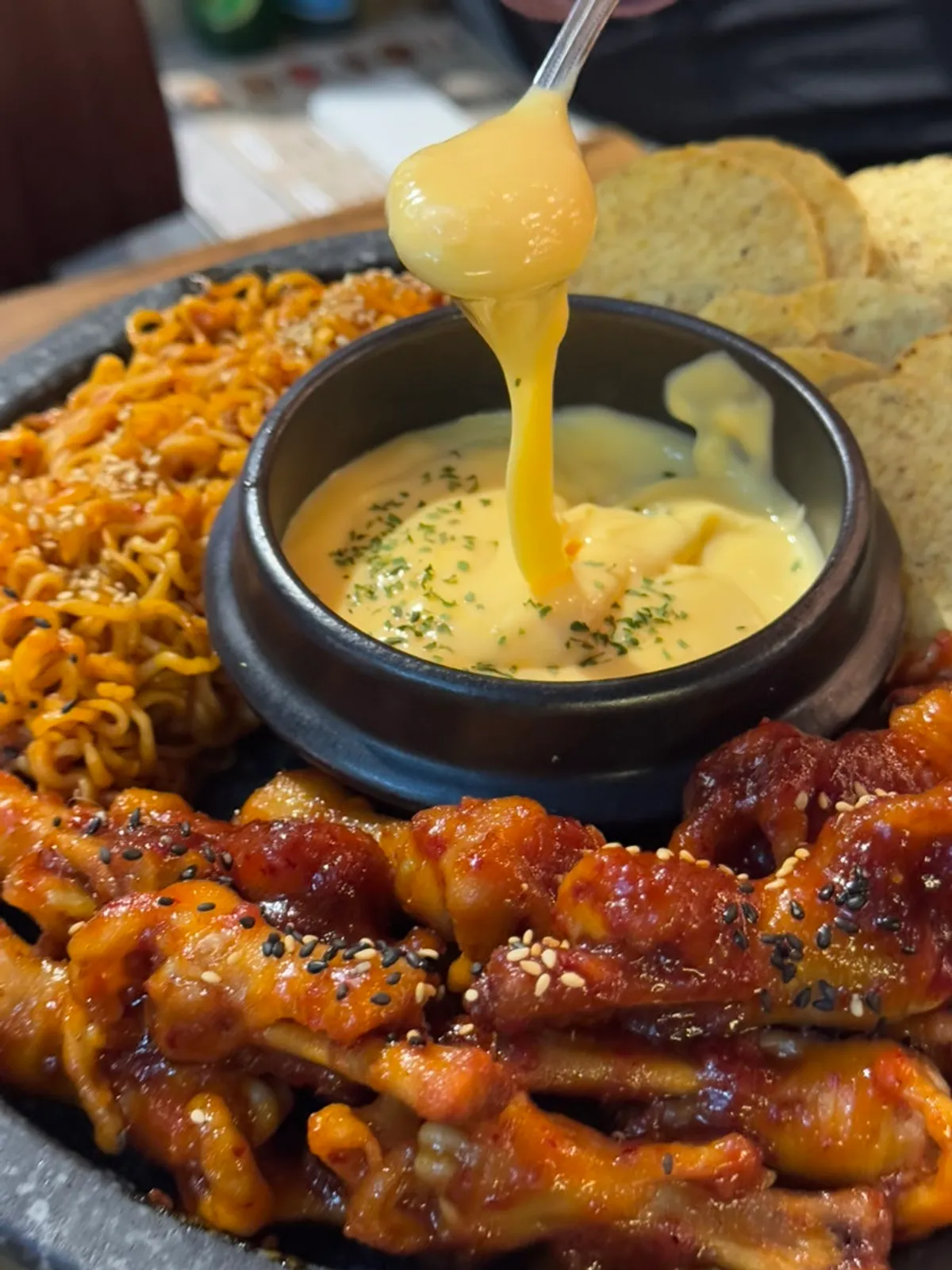 Table spread of fondue chicken feet at Mokhwa Silbi in Seomyeon