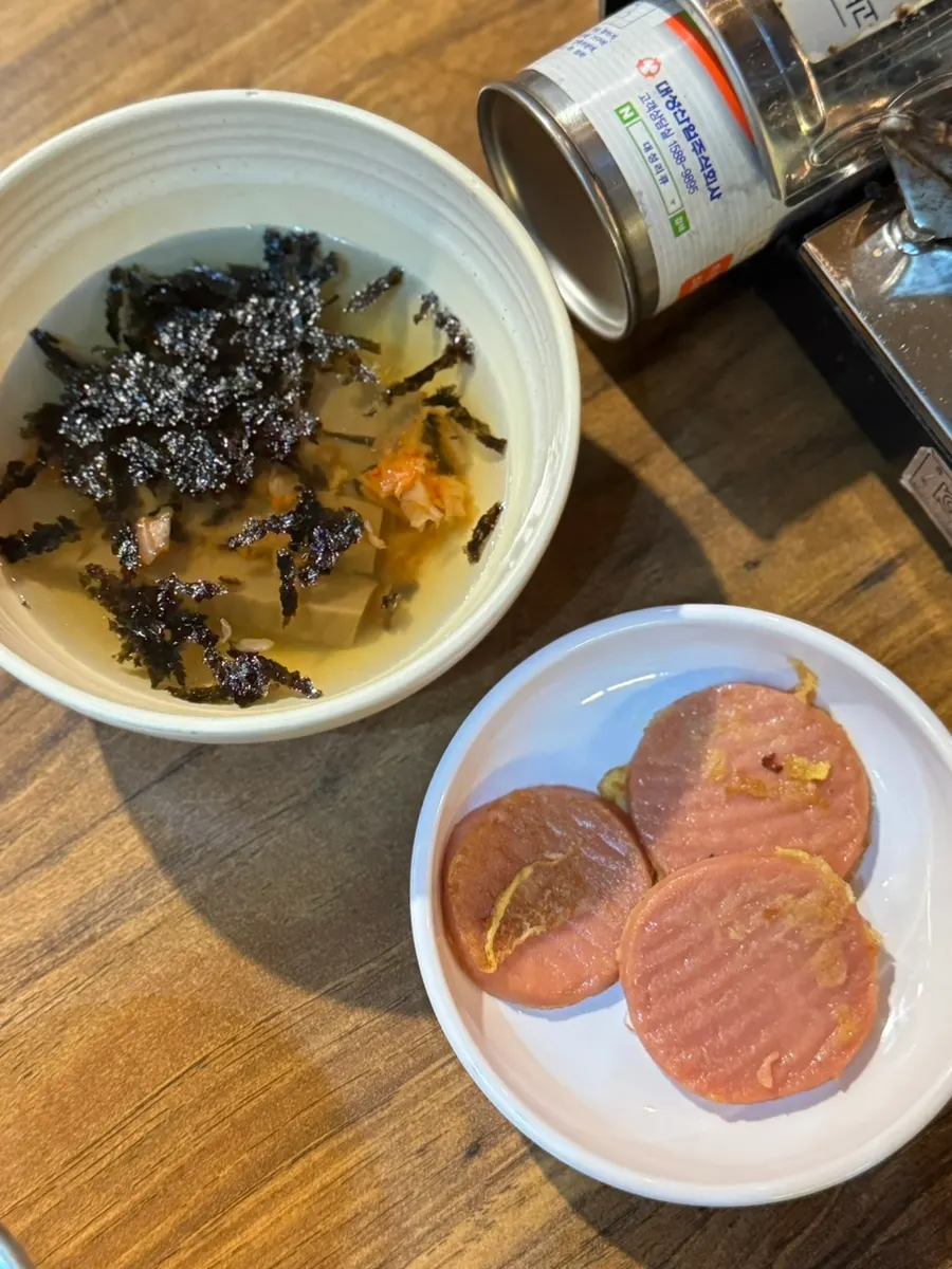 Side dish of acorn jelly slush and old-school sausage