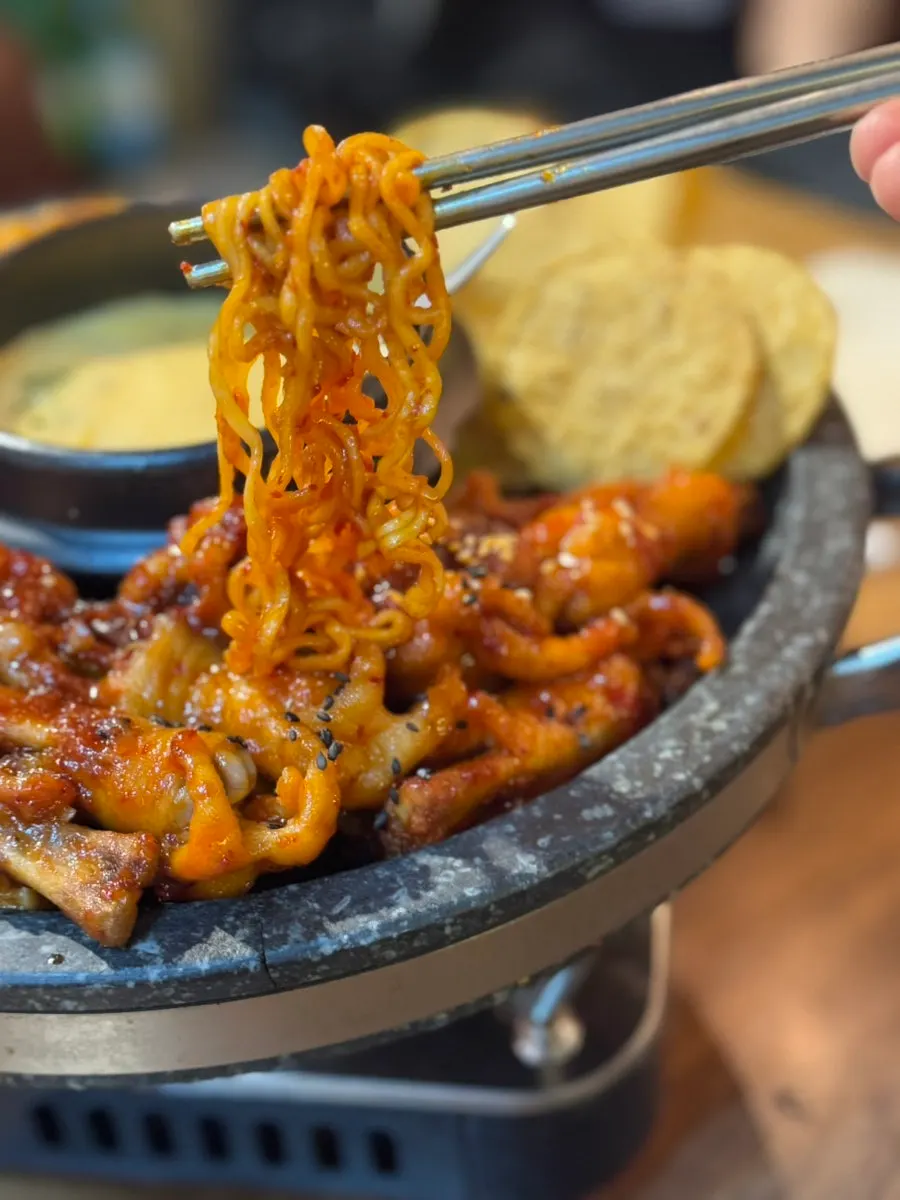 Ramyeon noodles mixed into the chicken feet sauce