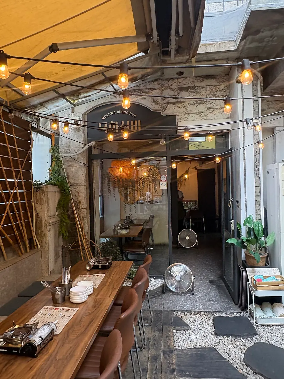 Half-outdoor pub-style seating at Mokhwa Silbi