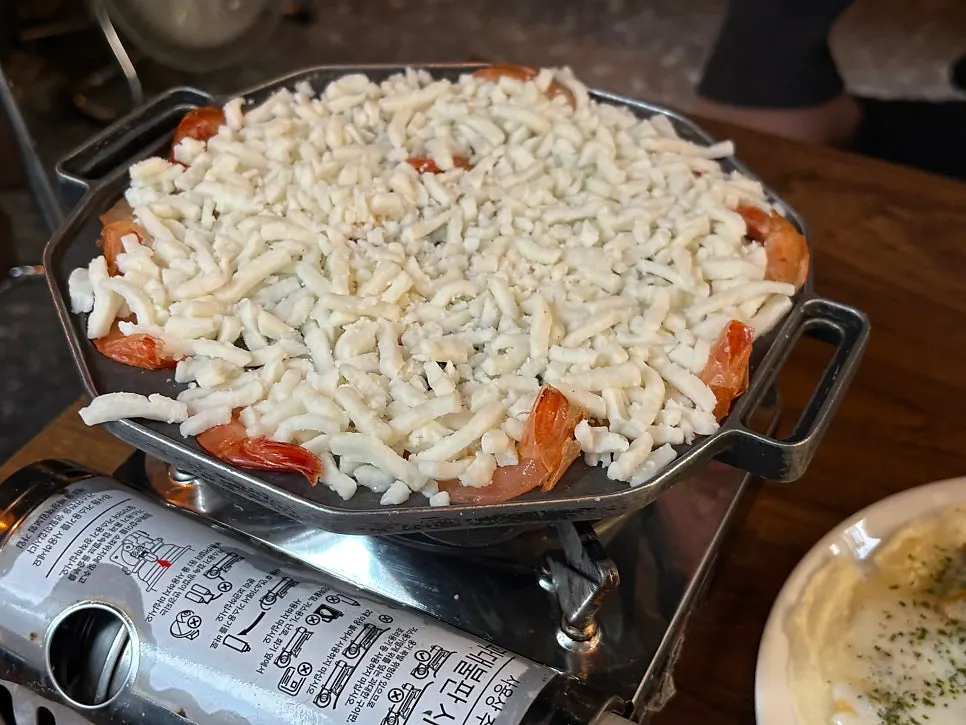 Cream cheese shrimp fondue piled high with cheese