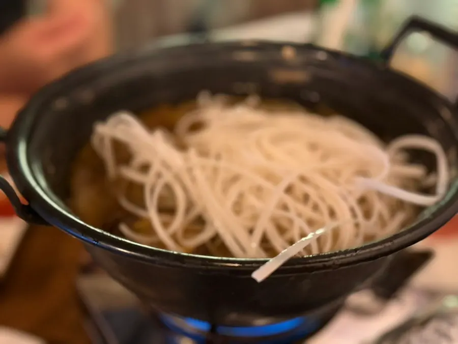 Eating the ingredients out of the mille-feuille nabe