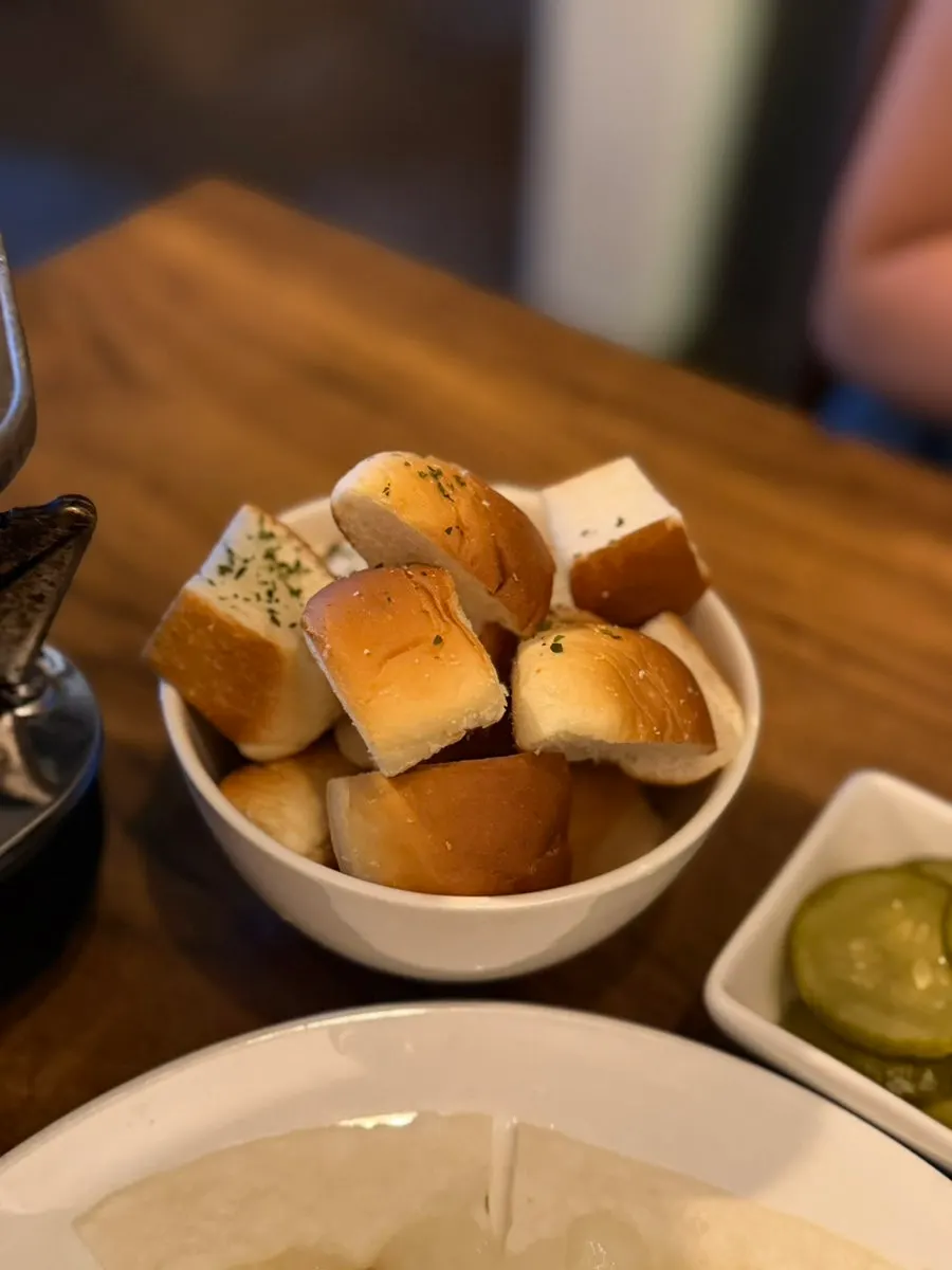 Pulling a shrimp out of the fondue