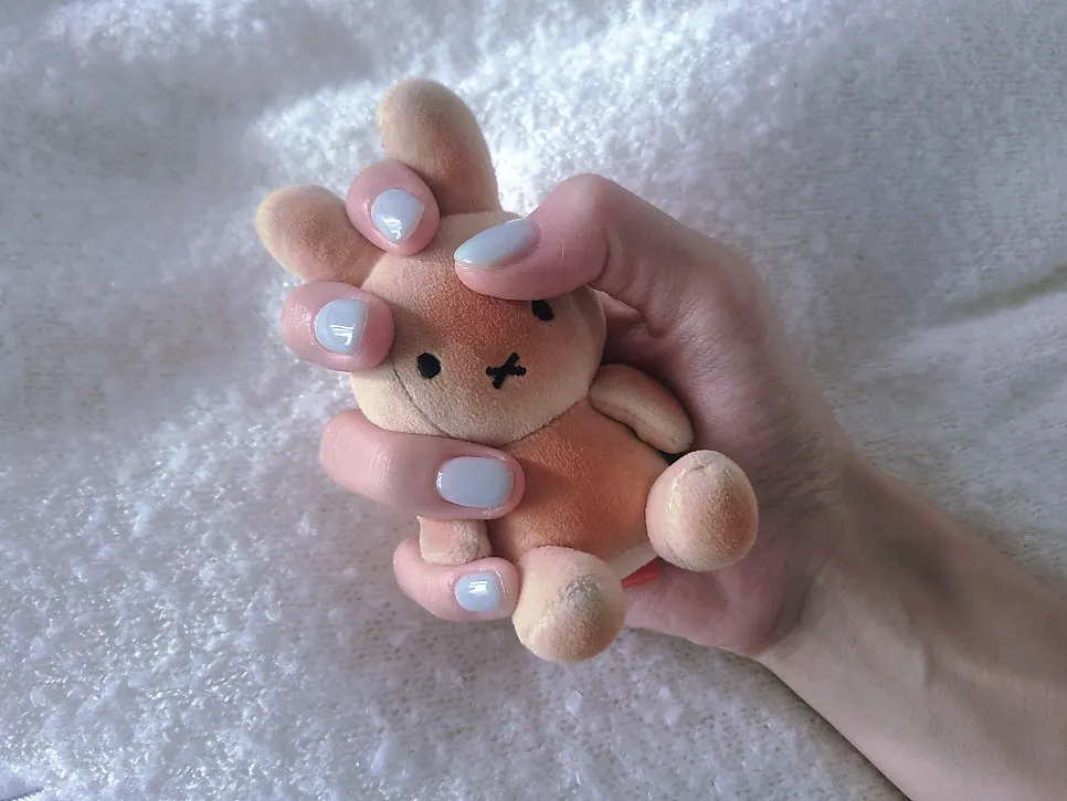 Hand with finished mint one-color nails