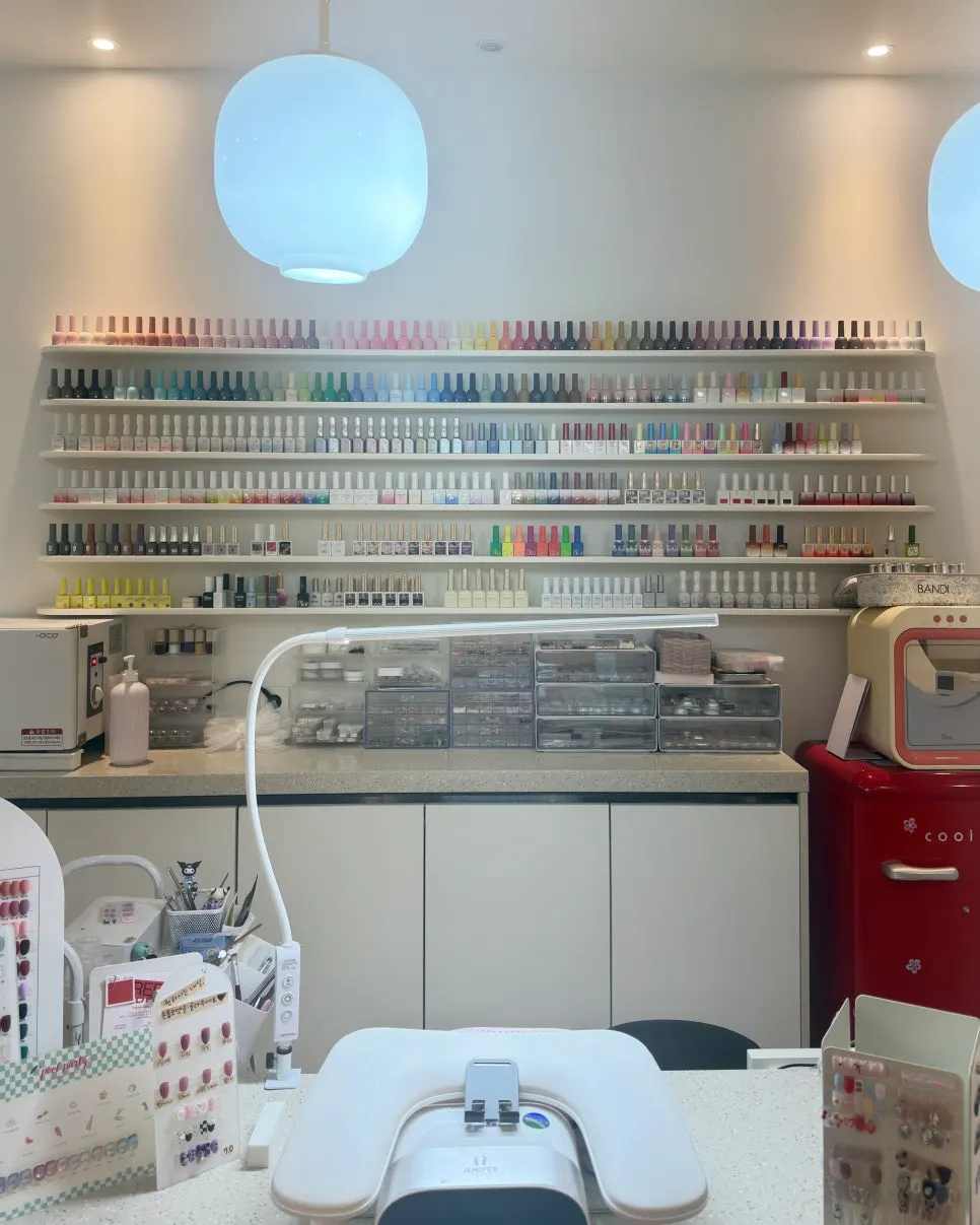 Display of nail color chips organized by color