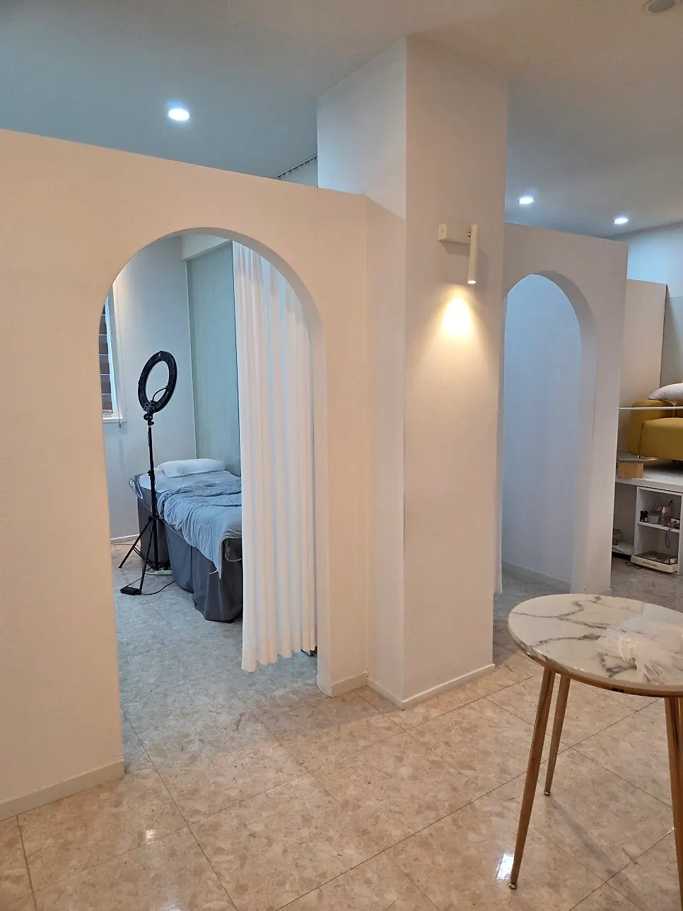 Spacious shop interior with beds set up for lash services