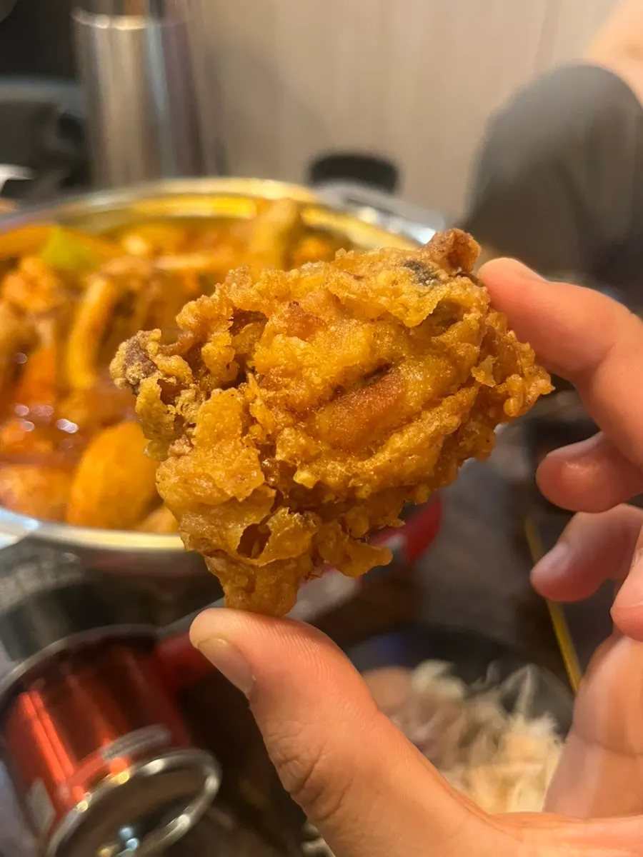 Yetnal tongdak dipped in seasoned chicken sauce