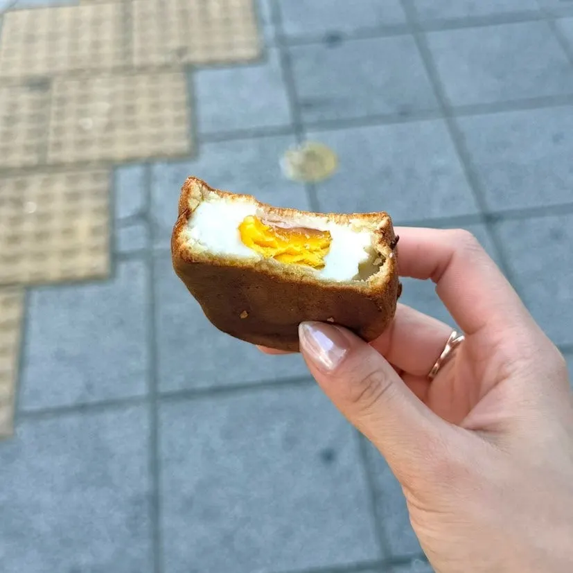 Peanut bread held in hand on the street