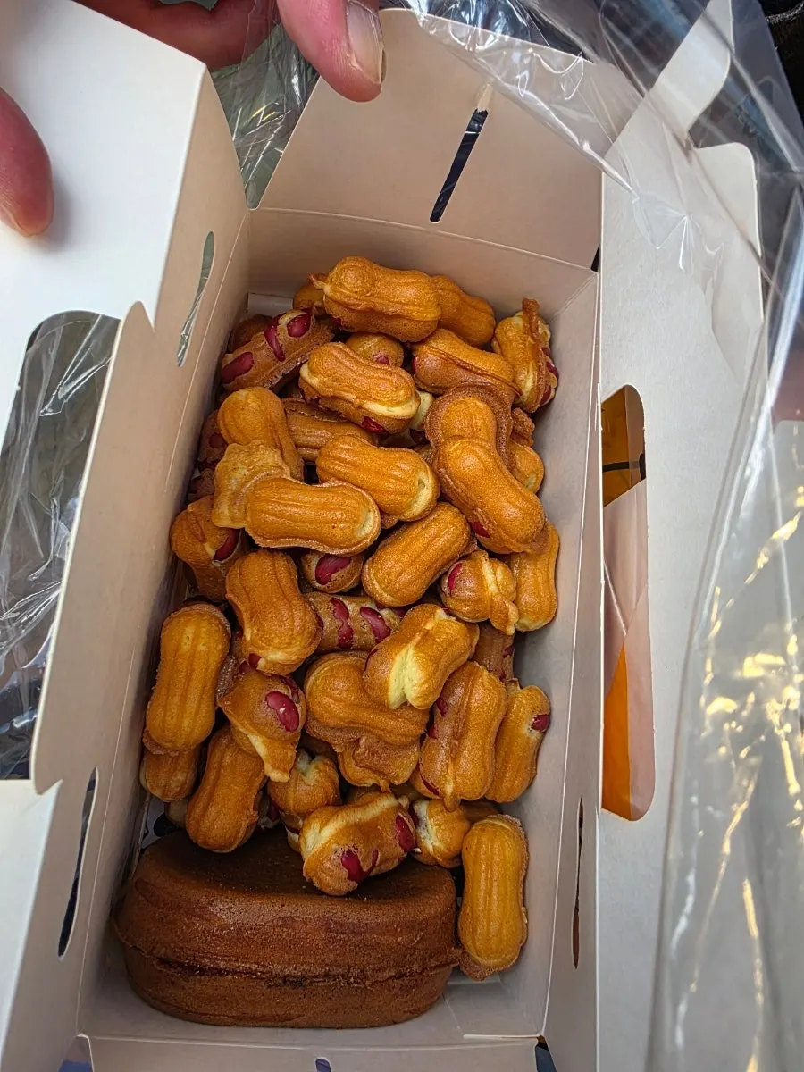 Peanut bread with whole peanuts held in hand