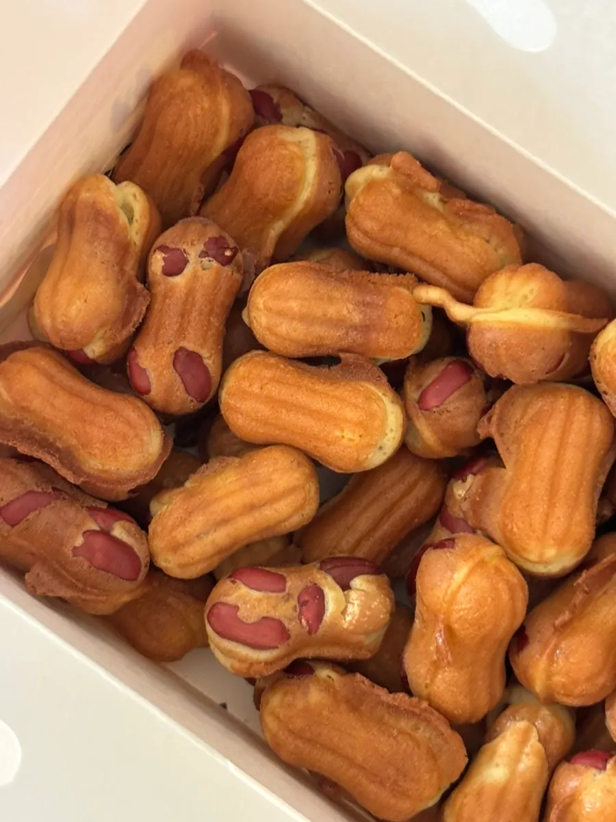 Box filled with peanut bread and egg bread