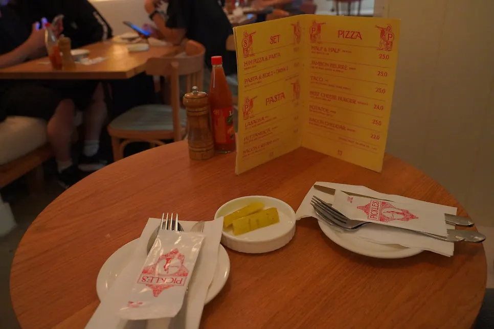 Self-service bar with water and pickles
