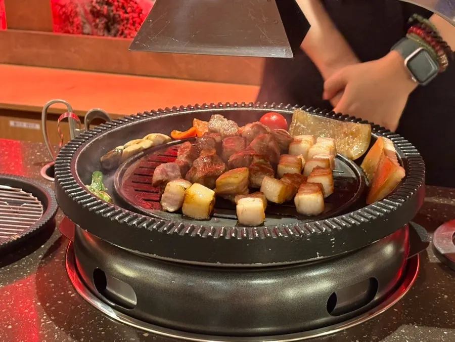 Staff grilling the Whole Half-Pig Set