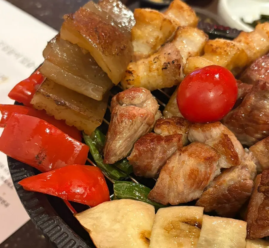 Pork neck, pork belly, and grilled vegetables